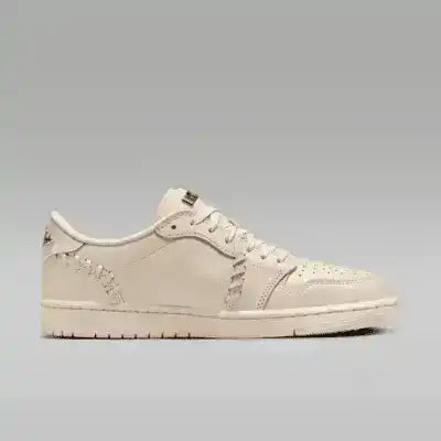 Cream low-top sneakers with swoosh details and tonal soles.