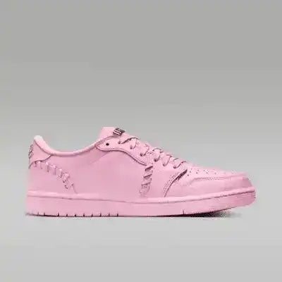 Pink low-top sneakers with gold-colored swoosh details.