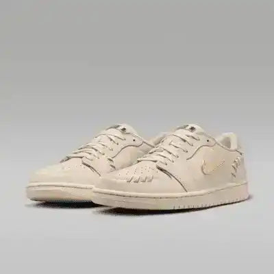 Cream low-top sneakers with swoosh details and tonal soles.