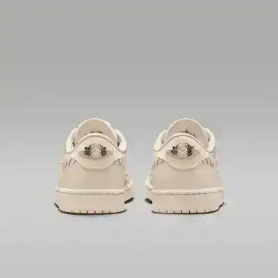 Cream low-top sneakers with swoosh details and tonal soles.