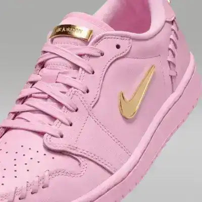 Low-top sneakers with gold-colored swoosh details, product views.