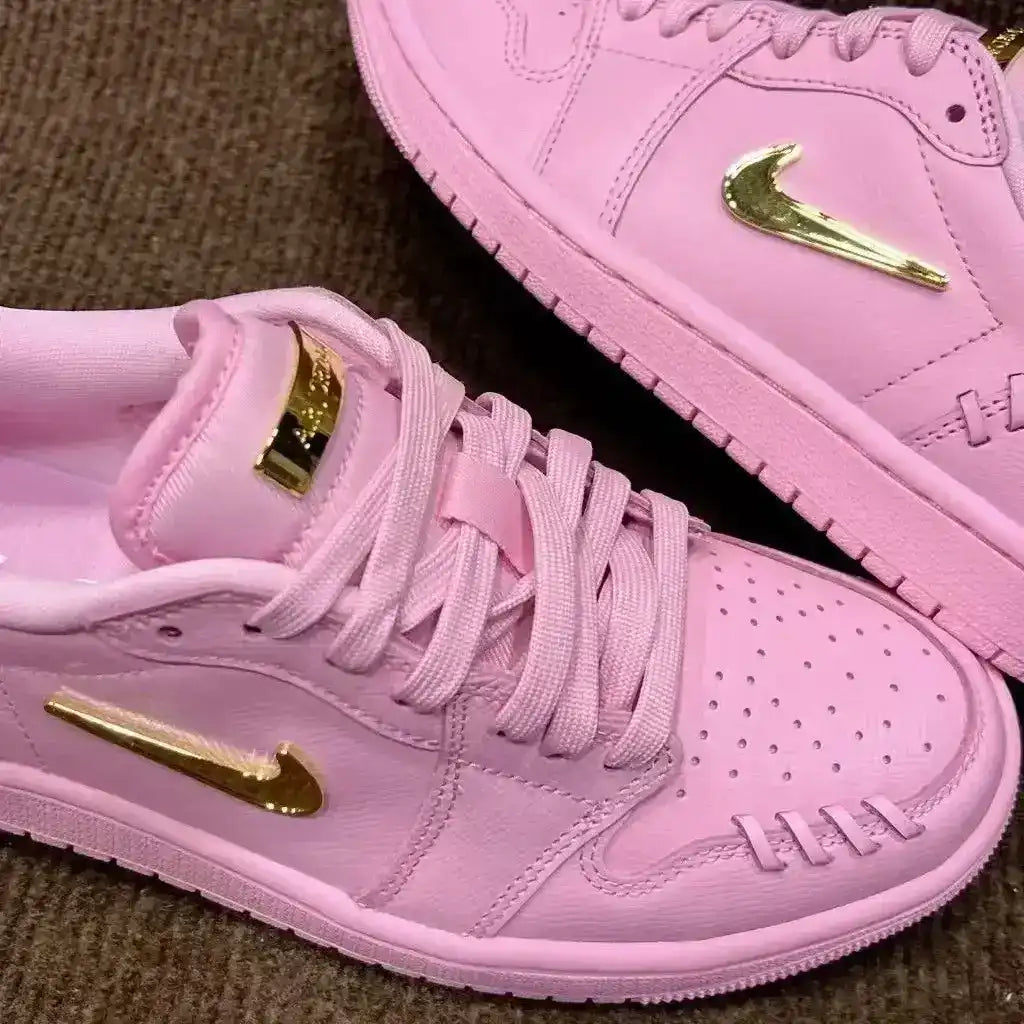 Swoosh-detail low-top sneakers, close-up and styling views.