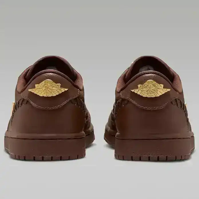Low-top sneakers with gold-colored swoosh details, product views.
