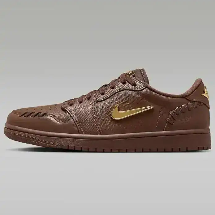 Low-top sneakers with gold-colored swoosh details, product views.