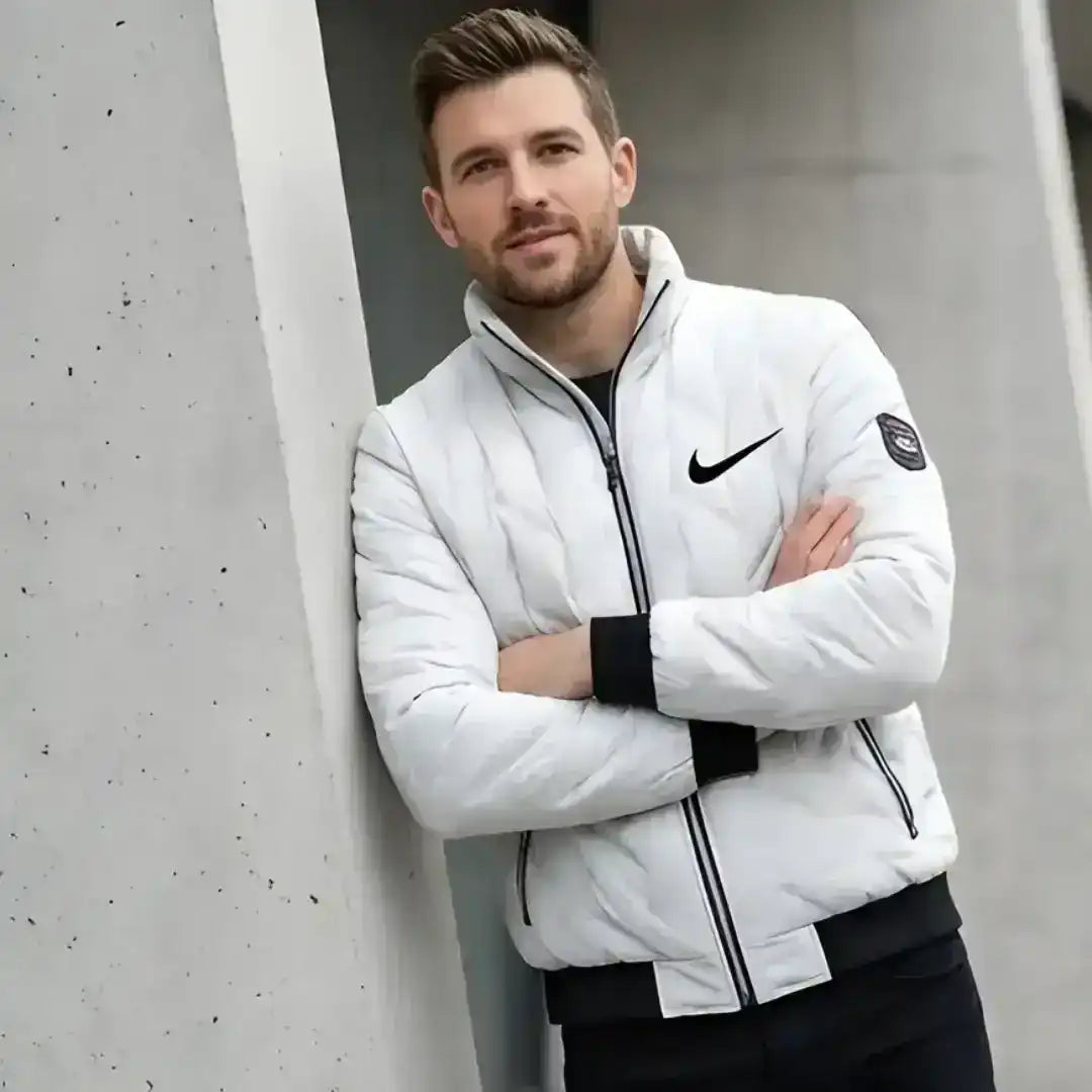 Nike jacket with quilted panels and functional zip pockets
