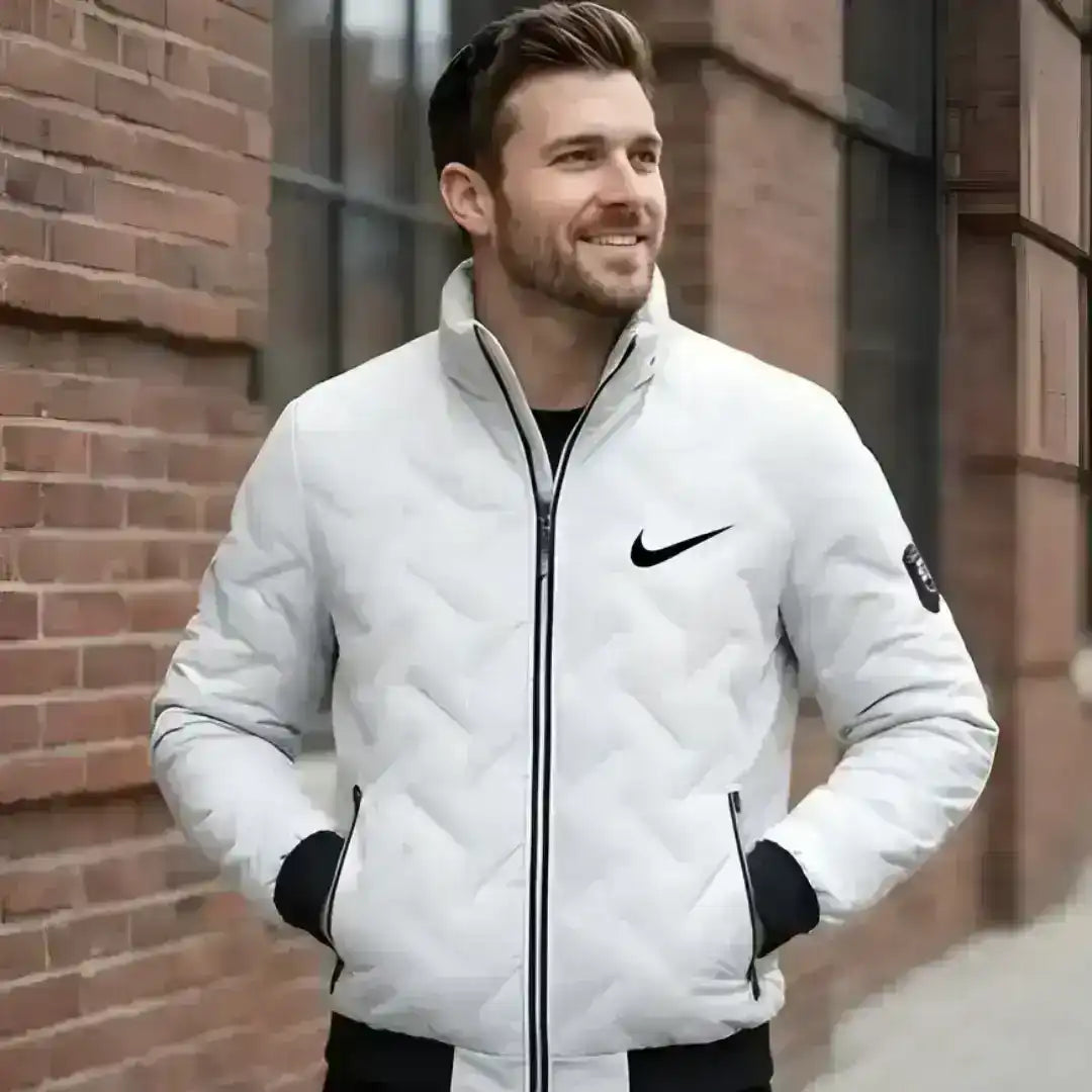 Nike sports jacket with quilted texture and minimalist branding
