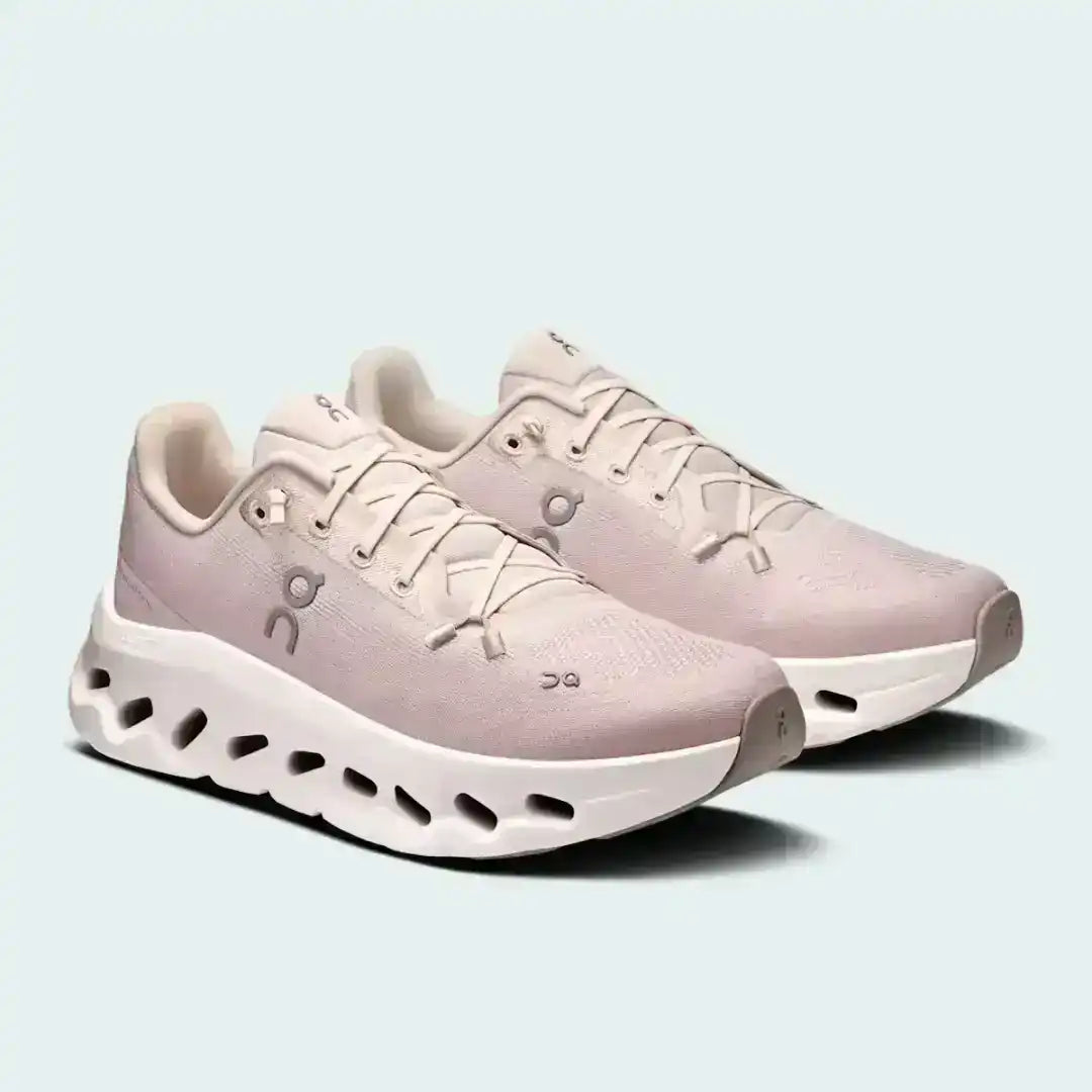 Pale pink lace-up sneakers with cutout-style midsoles, product views.