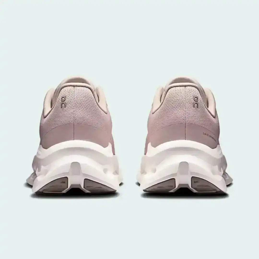 Pale pink lace-up sneakers with cutout-style midsoles, product views.