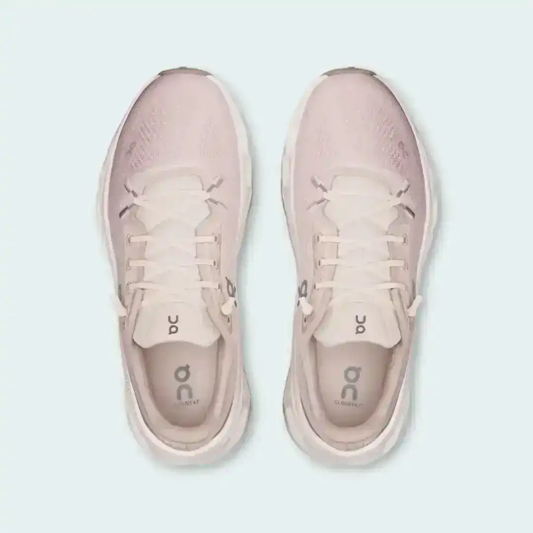 Pale pink lace-up sneakers with cutout-style midsoles, product views.