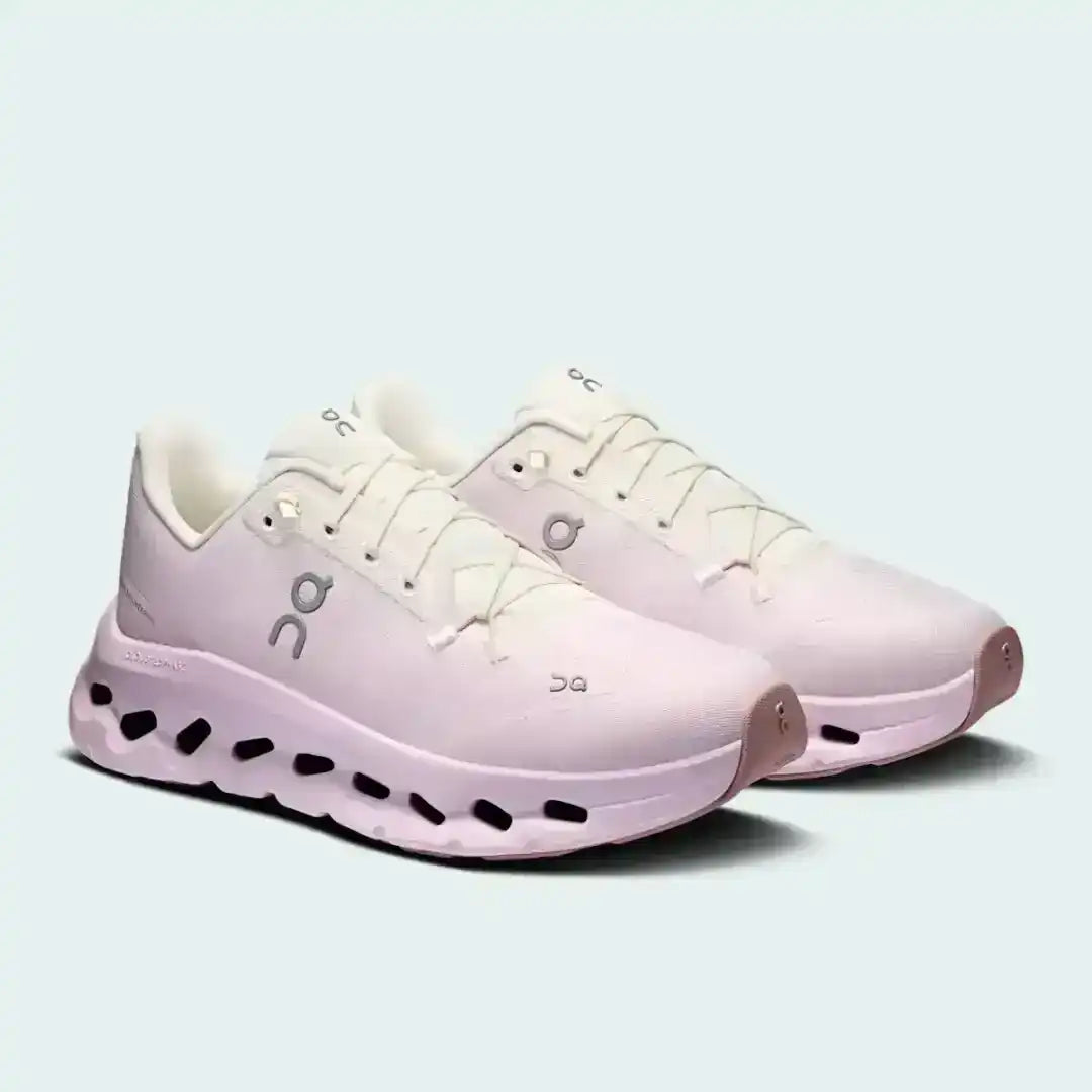 Pale pink lace-up sneakers with sculpted cutout-style midsoles.