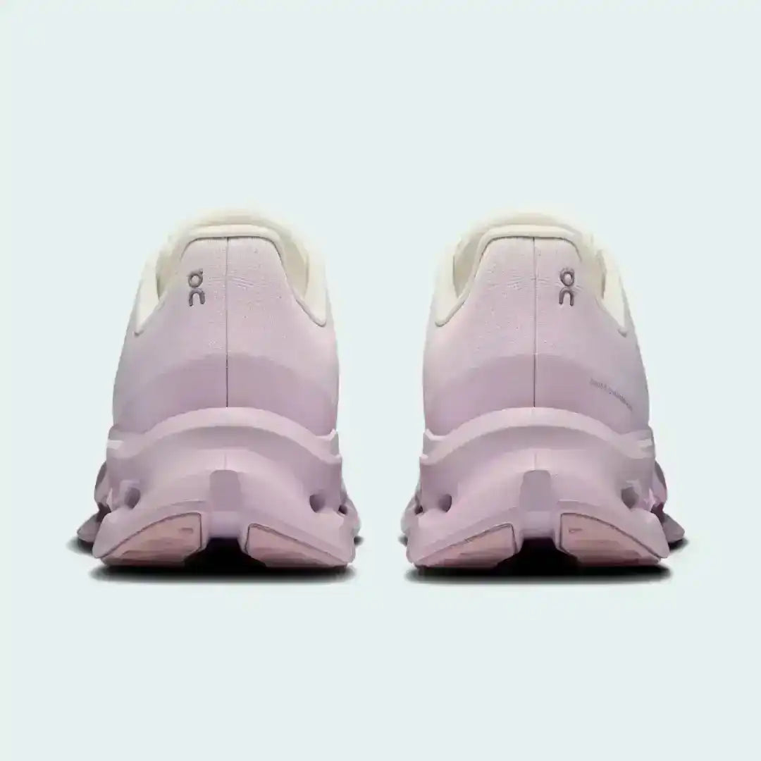 Pale pink lace-up sneakers with sculpted cutout-style midsoles.