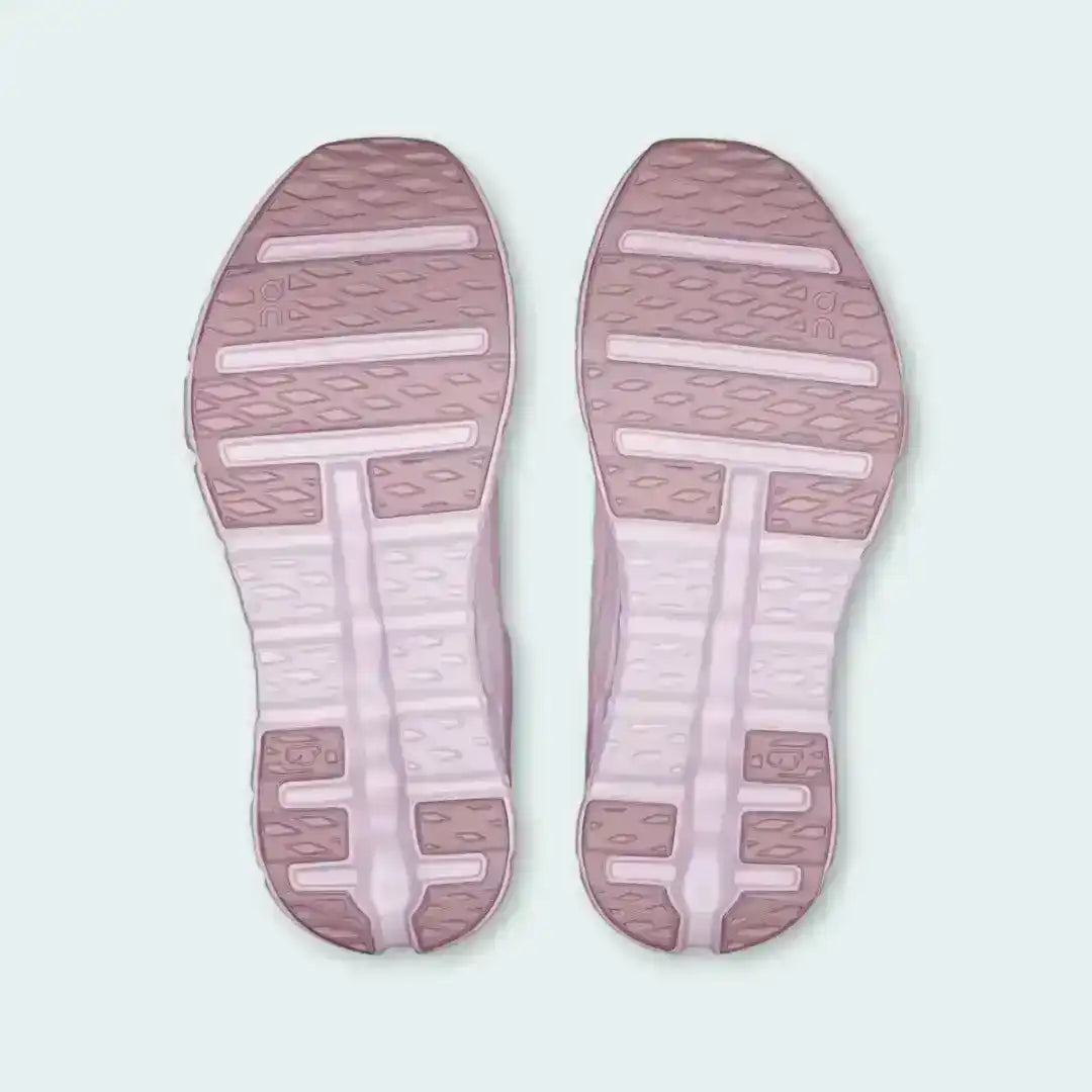 Pale pink sneaker outsoles with contrasting strips, bottom pair view.