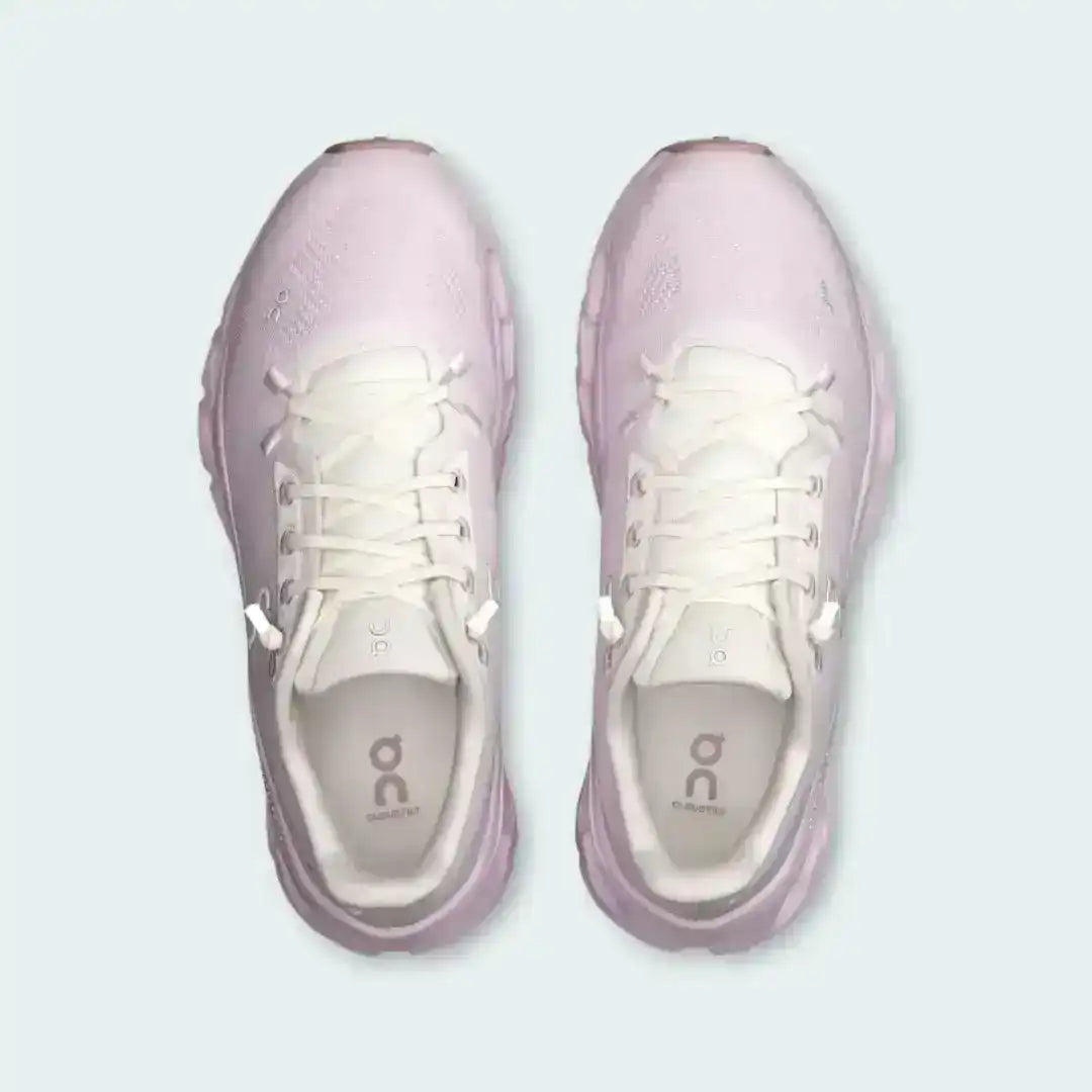 Pale pink lace-up sneakers with sculpted cutout-style midsoles.