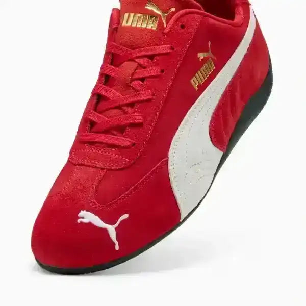 Full view of Puma Speedcat Red sneakers styled for a modern Y2K streetwear look