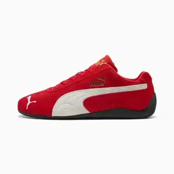 Red Puma sneaker with white accents on a white background