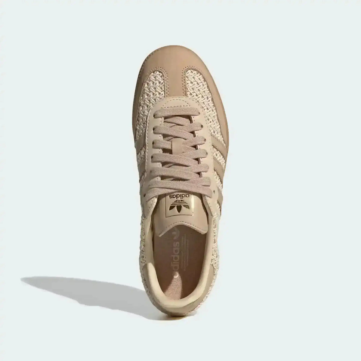 Side profile of Adidas Samba OG Raffia featuring a unique woven beige upper and classic gum sole