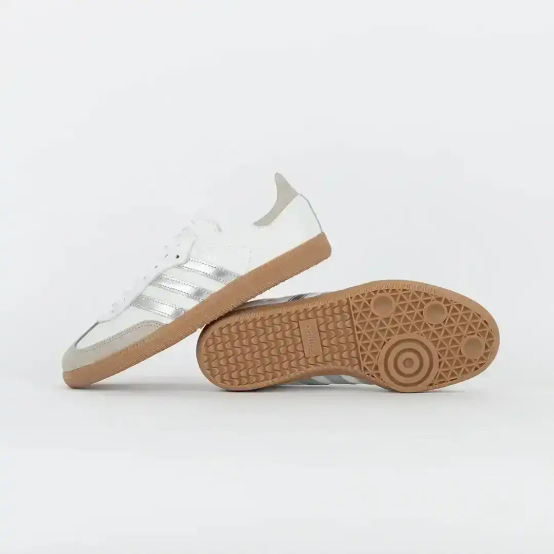 White sneaker beside its gum-colored outsole, side and bottom views.