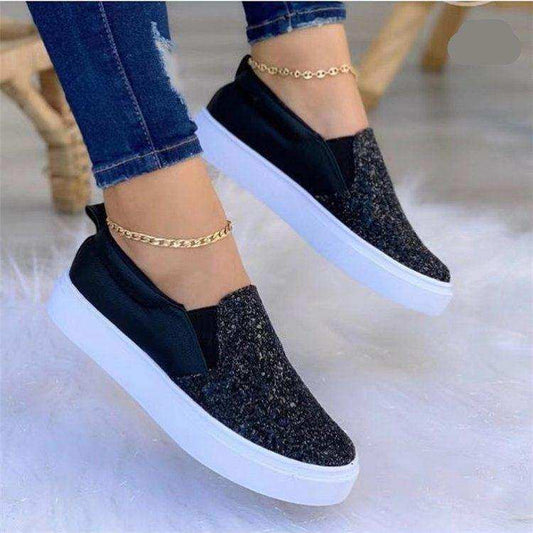 Stardust Black Glitter Slip-On Sneakers. Black glitter-look upper.