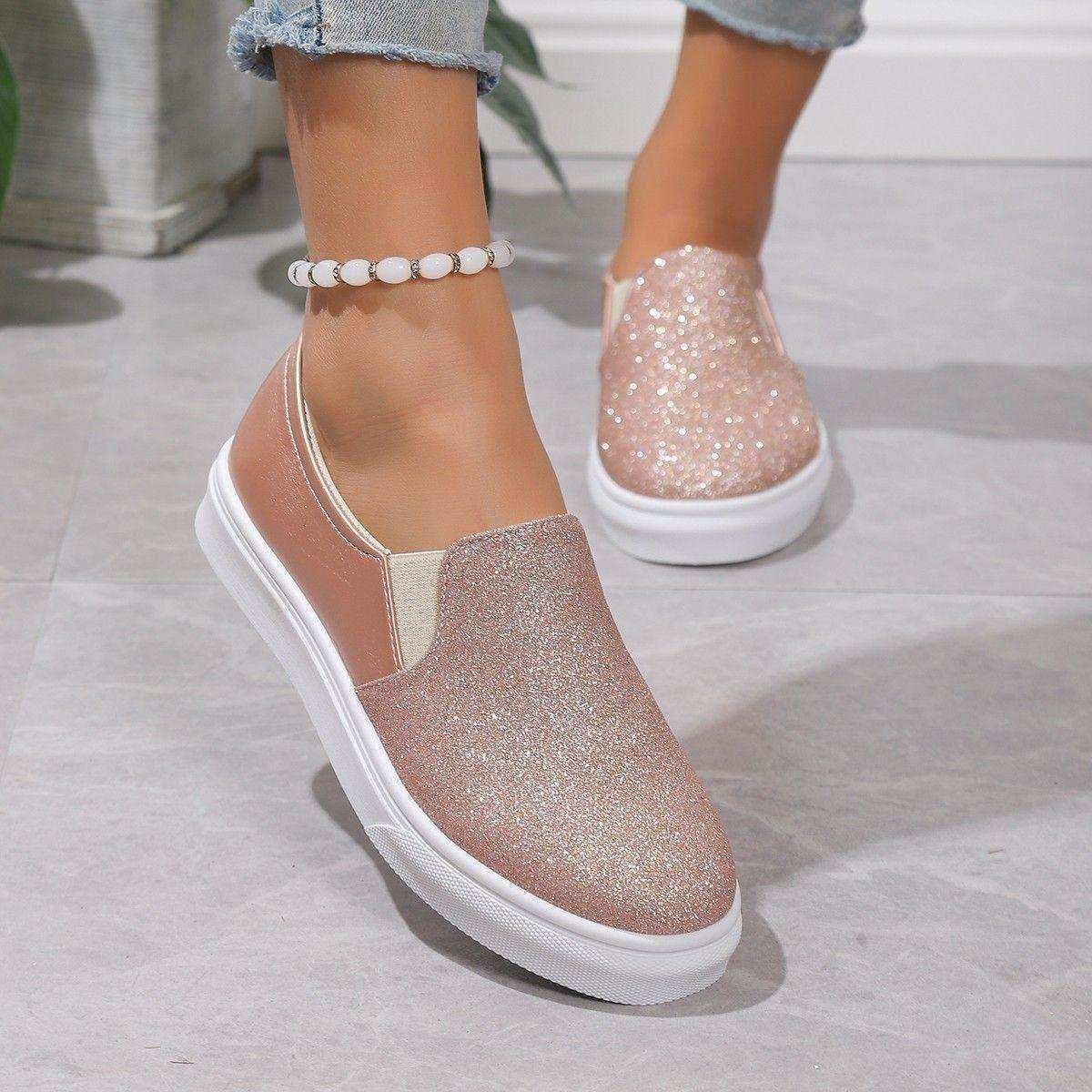Glitter-finish platform slip-on shoes styled with jeans.