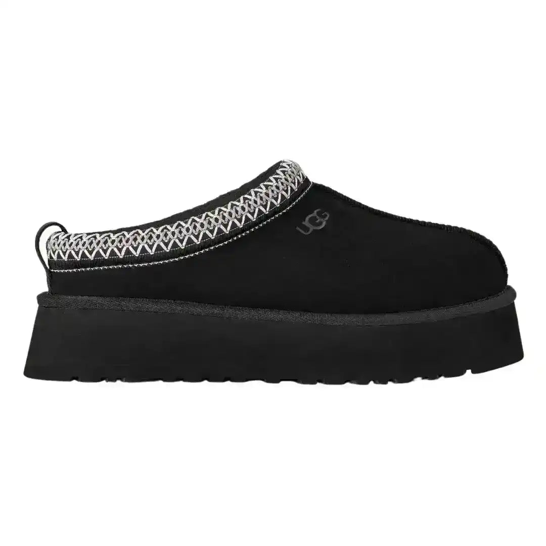 Black UGG Tazz suede mules with red and white braid stitching, offering a subtle pop of color to a classic winter shoe silhouette.