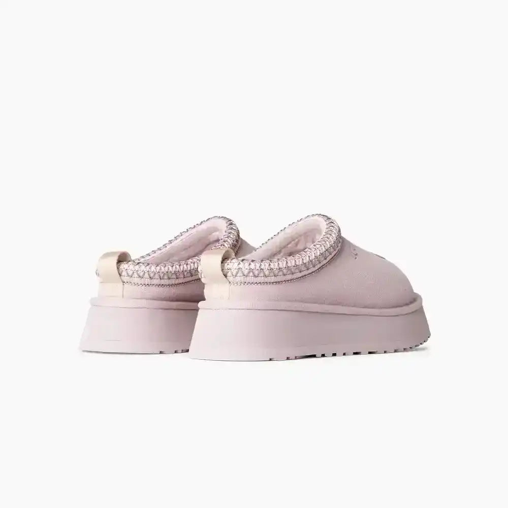 Stylish pink UGG Tazz footwear featuring a thick platform, perfect for elevating simple jeans and tee looks with a pop of color.