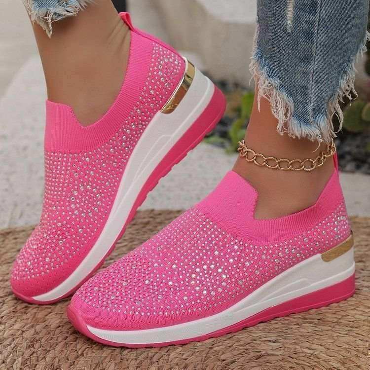 Rhinestone-decorated slip-on sneakers in several colors.