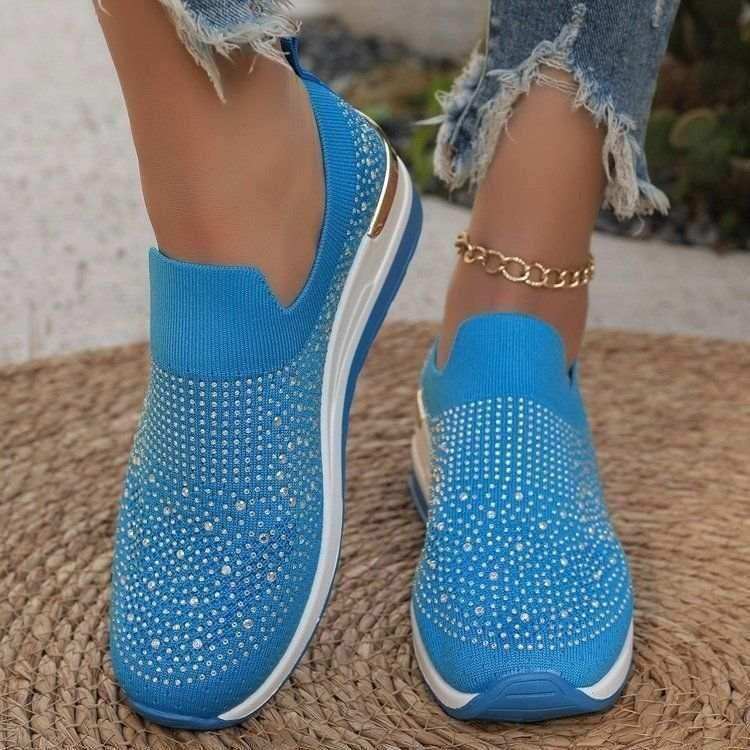 Rhinestone-decorated slip-on sneakers in several colors.