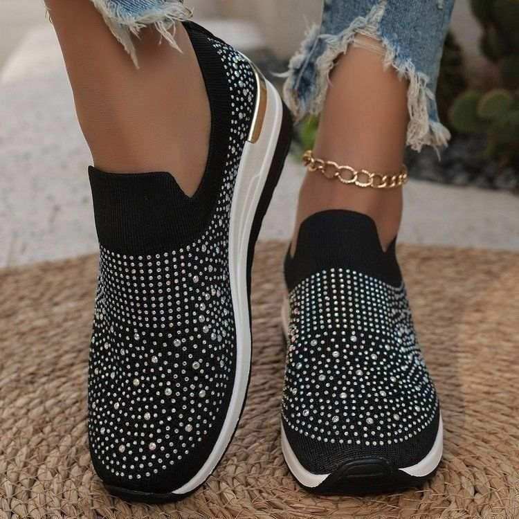 Rhinestone-decorated slip-on sneakers in several colors.
