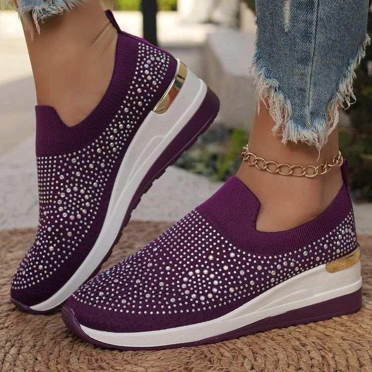 Rhinestone-decorated slip-on sneakers in several colors.