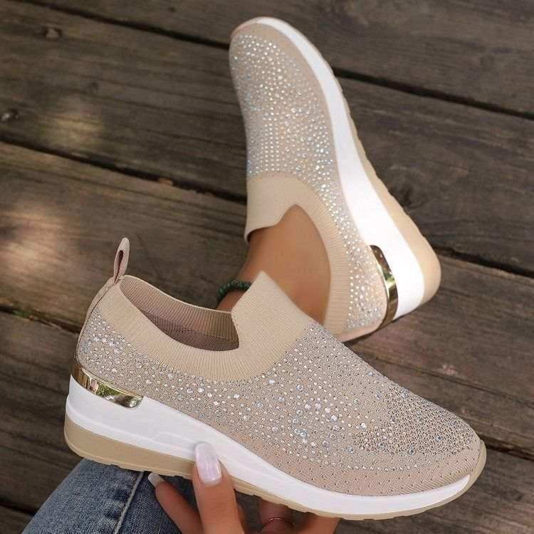 Rhinestone-decorated slip-on sneakers in several colors.
