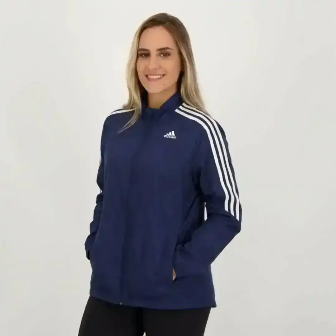 Adidas dark blue sports jacket with high collar and athletic fit
