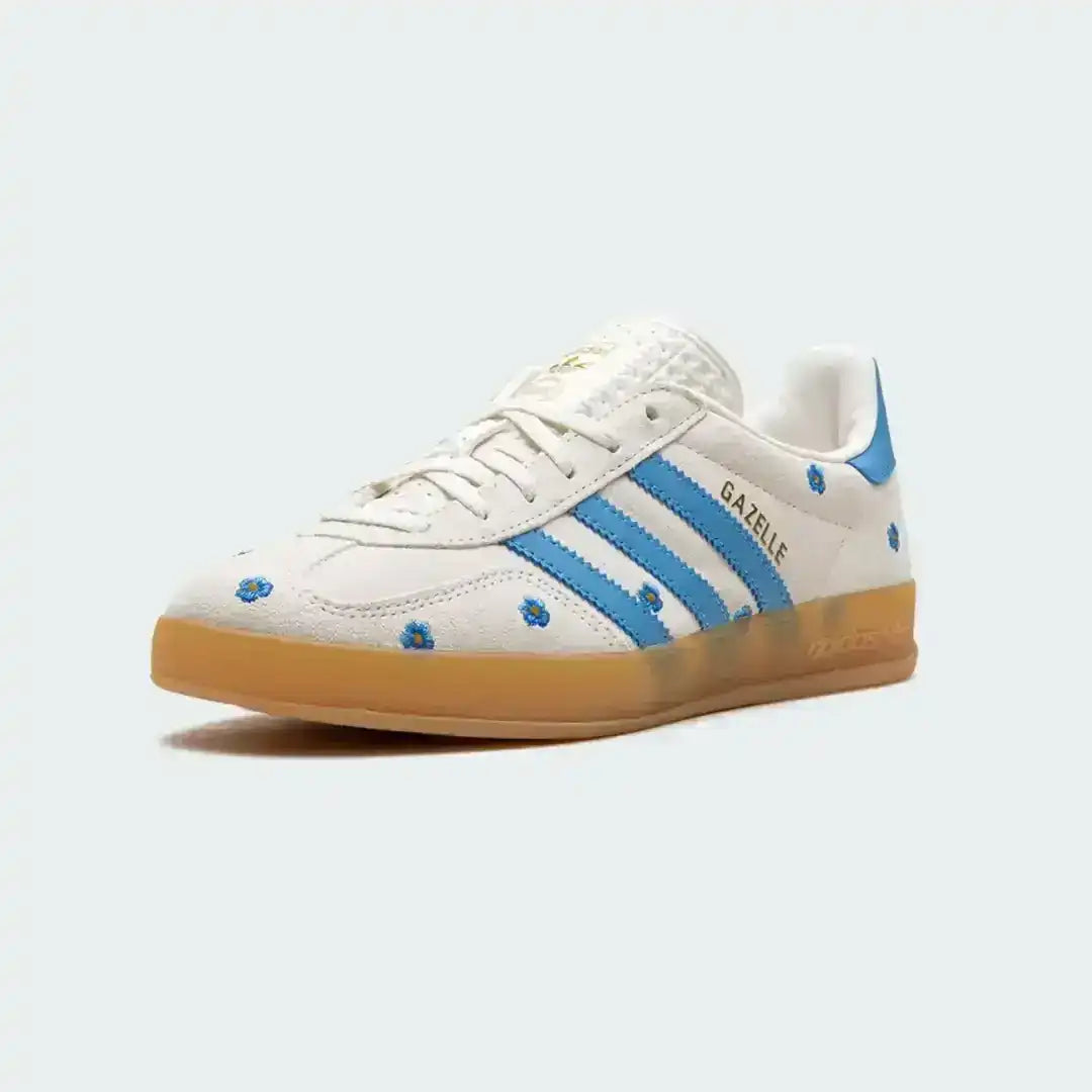 Adidas Gazelle floral edition featuring white suede, embroidered blue flowers, classic blue three-stripes design and a smooth retro gum outsole.