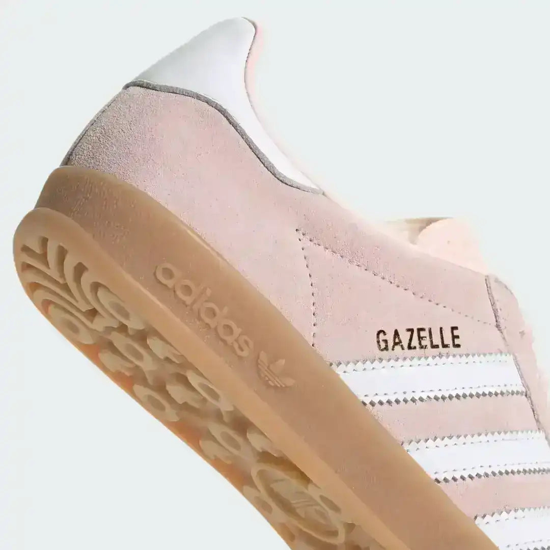 Top down detail view of pink suede texture and white leather stripes on the Adidas Gazelle Indoor