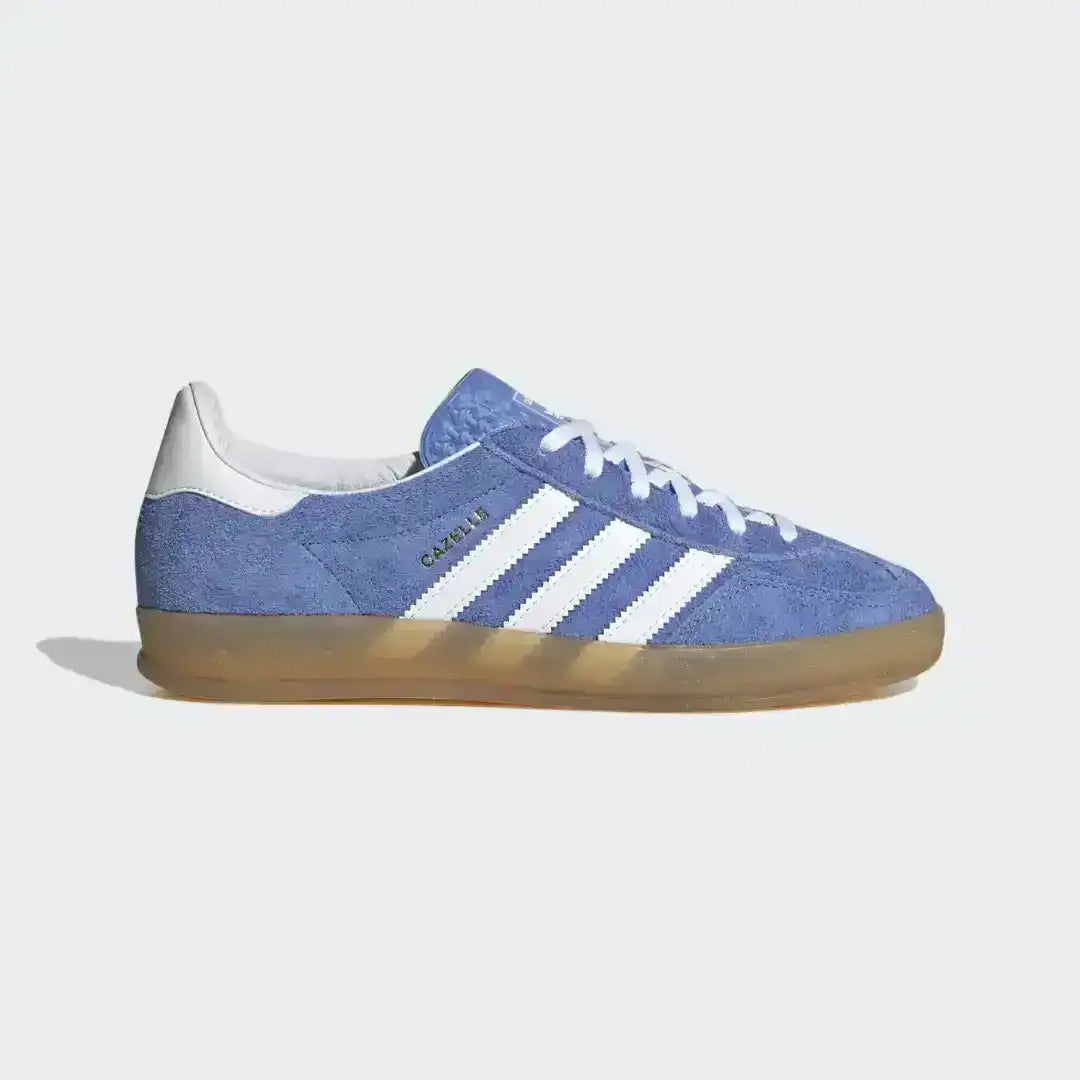 Side view of the Adidas Gazelle Indoor Blue Suede edition, highlighting the gold foil branding (if present), white leather heel tab, and retro gum sole unit.