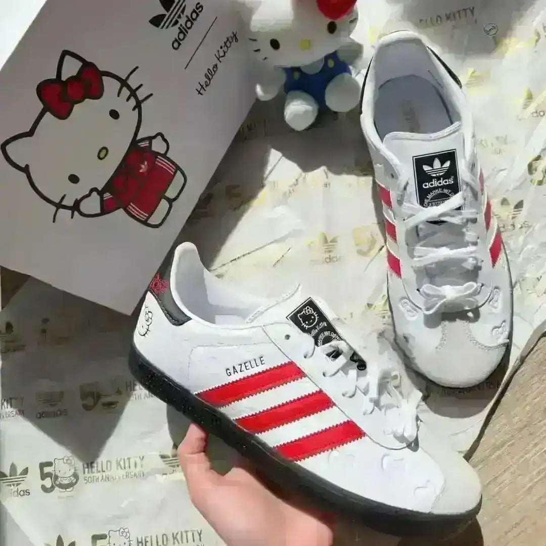Fashionable Hello Kitty Adidas Gazelle Indoor shoes in white and red, designed with an all-over embossed bow print, red three stripes, and a durable semi-transparent dark gum rubber sole.
