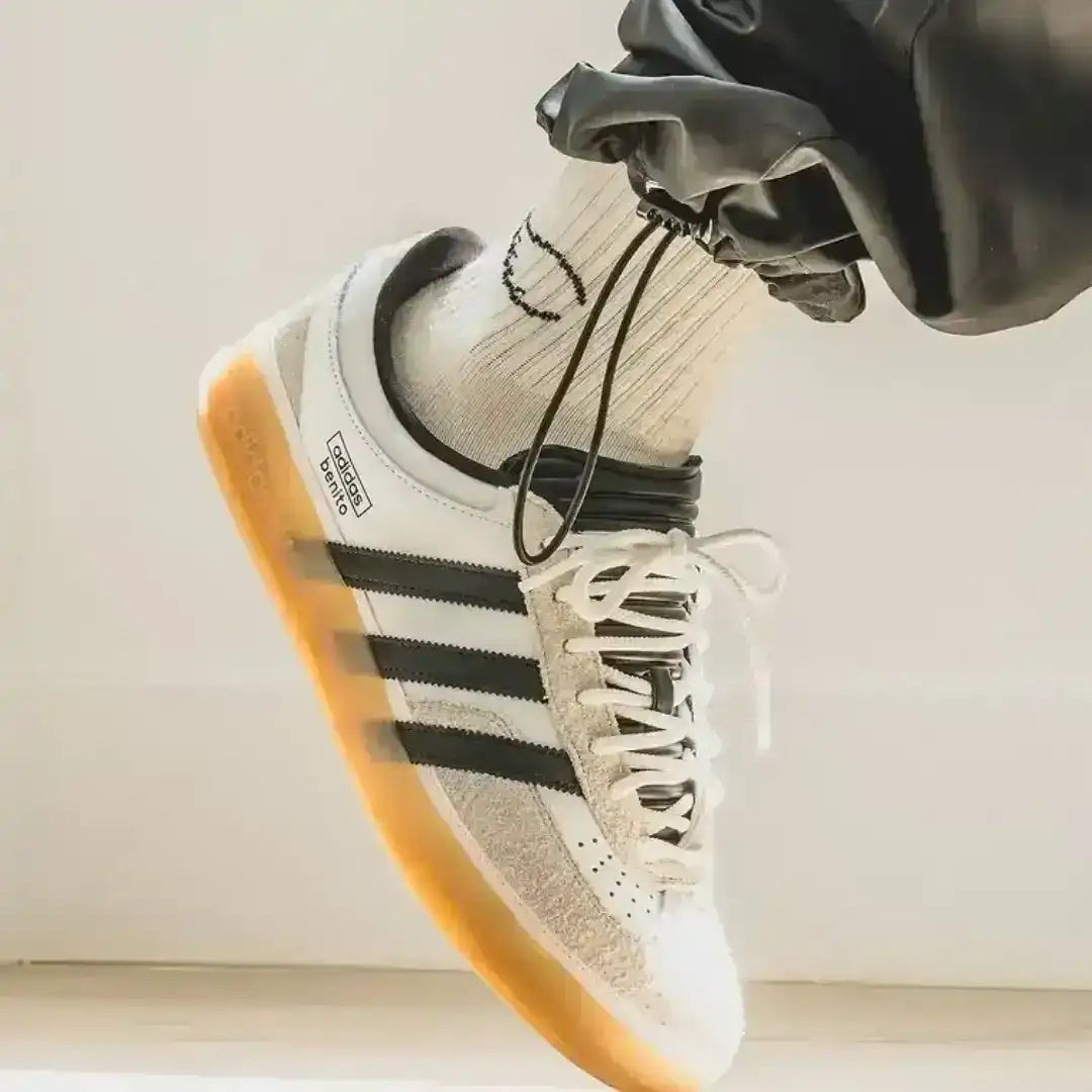Adidas Gazelle Indoor Santo Domingo sneaker side profile featuring premium white leather and black stripes with gum sole