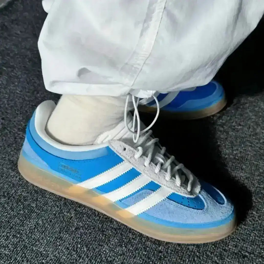 On-foot styling of Adidas Gazelle Indoor Santo Domingo sneakers with blue denim in an urban setting