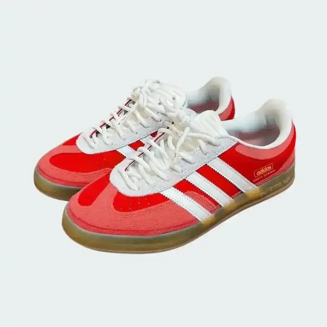 Red and white sneakers with a visible brand logo on a light gray background