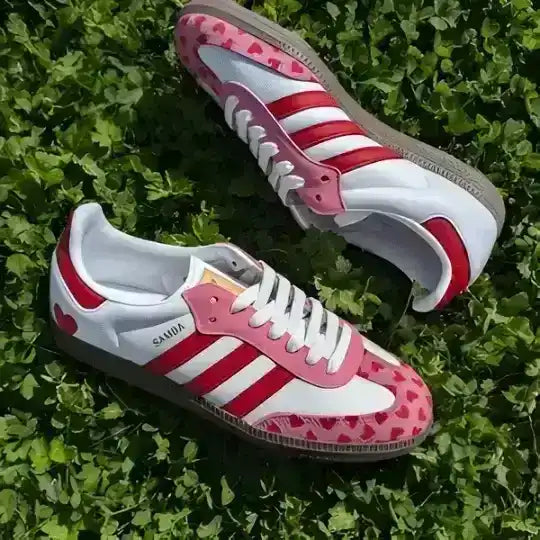 Profile view of the Adidas Love Heart 2026 Special Edition sneaker featuring white leather and romantic red details.