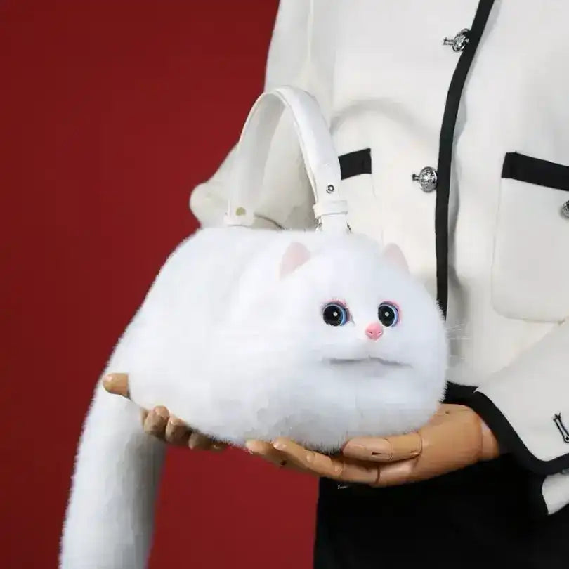 Fuzzy cat-shaped handbag with a handle and long tail detail.