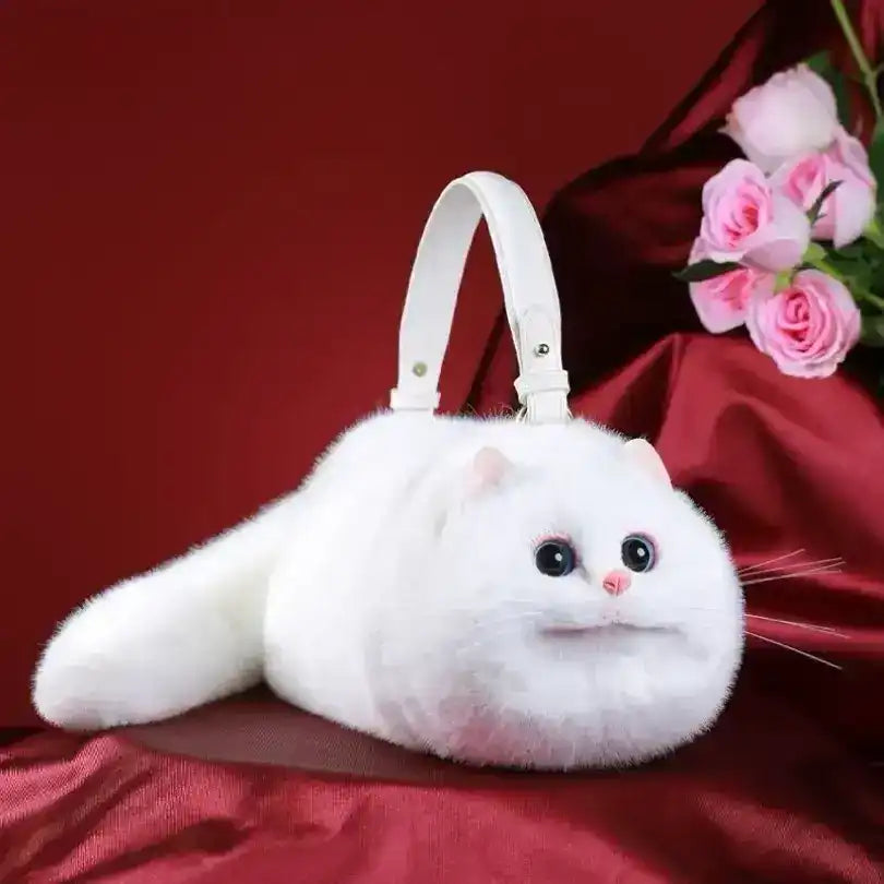 Fuzzy cat-shaped handbag with a handle and long tail detail.