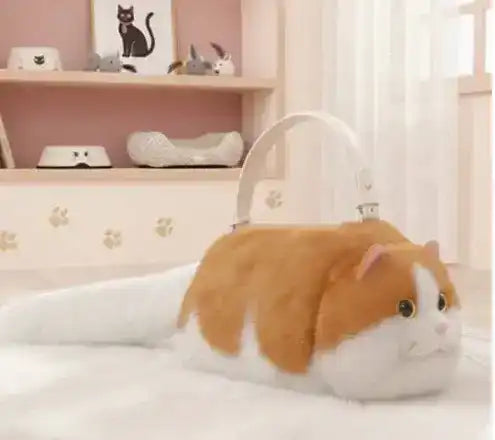 Fuzzy cat-shaped handbag with a handle and long tail detail.