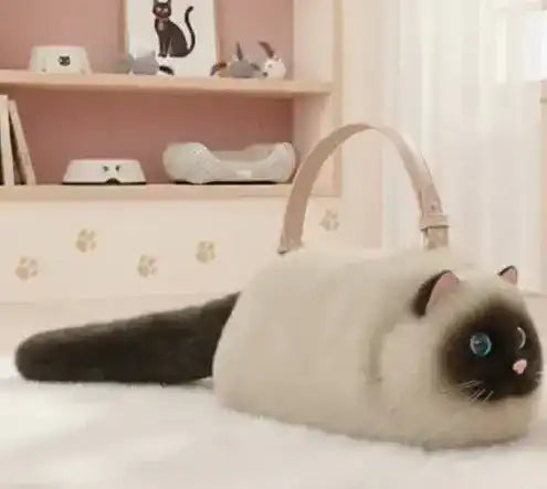 Fuzzy cat-shaped handbag with a handle and long tail detail.
