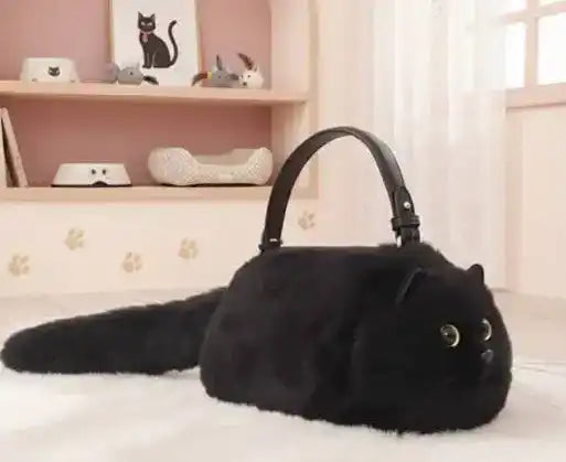 Fuzzy cat-shaped handbag with a handle and long tail detail.