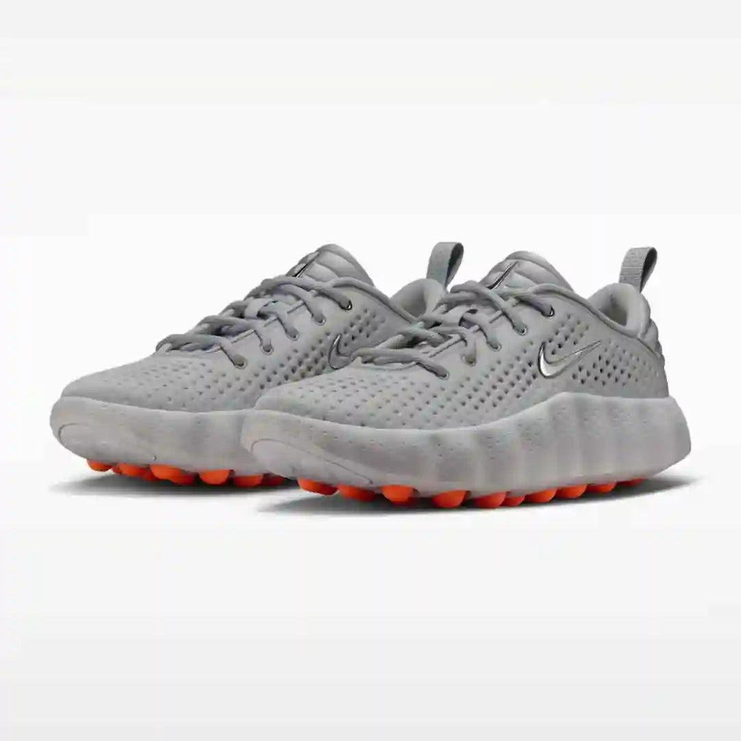 Gray mesh-panel sneakers with orange sole pods, pair view.