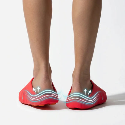 Red backless footwear shown on feet, with sidewall detail graphics.