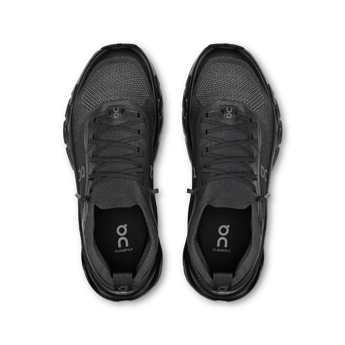 Black lace-up sneakers with cutout-style midsoles.
