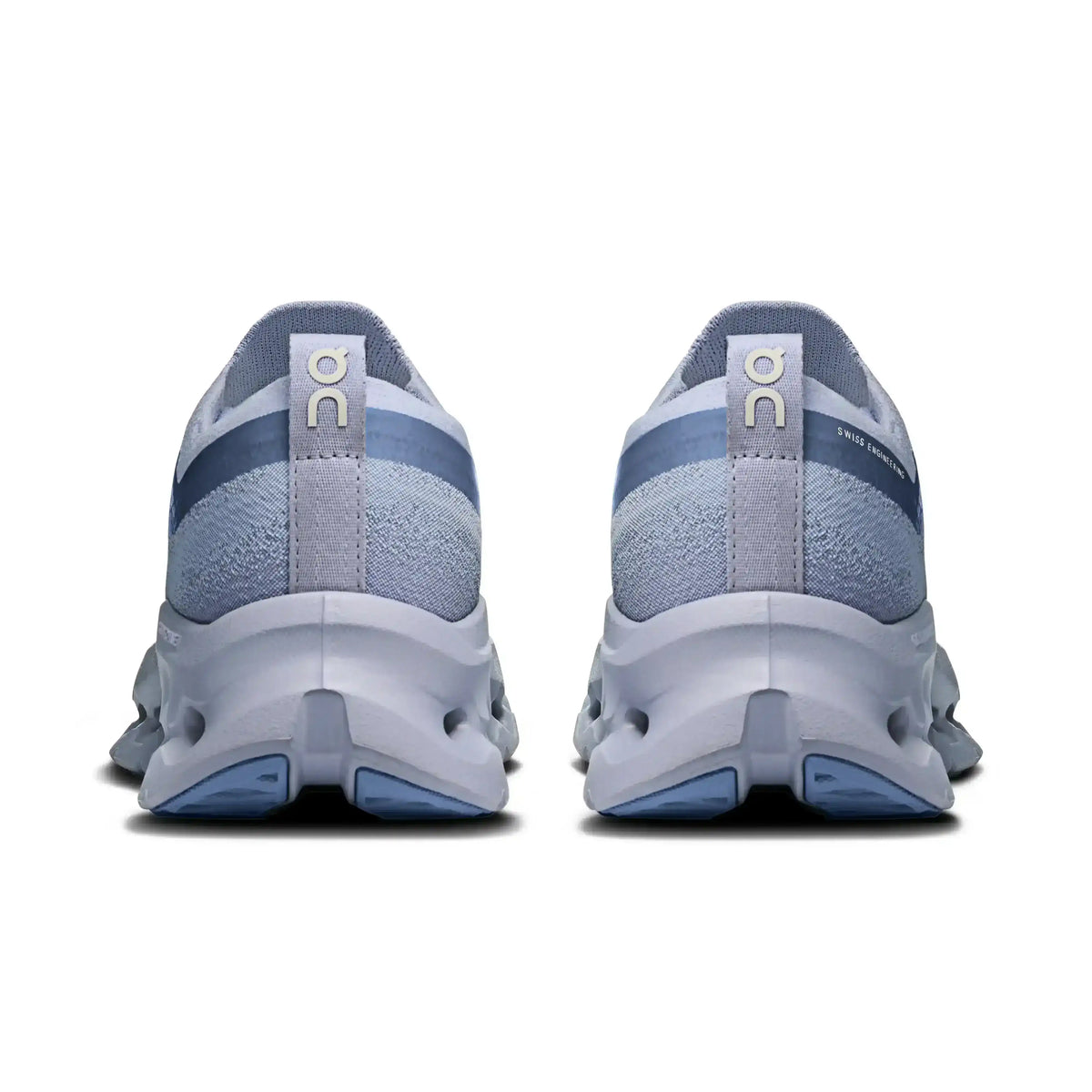 Light blue lace-up sneakers with cutout-style midsoles.