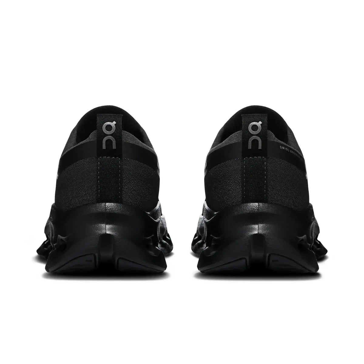 Black lace-up sneakers with cutout-style midsoles.