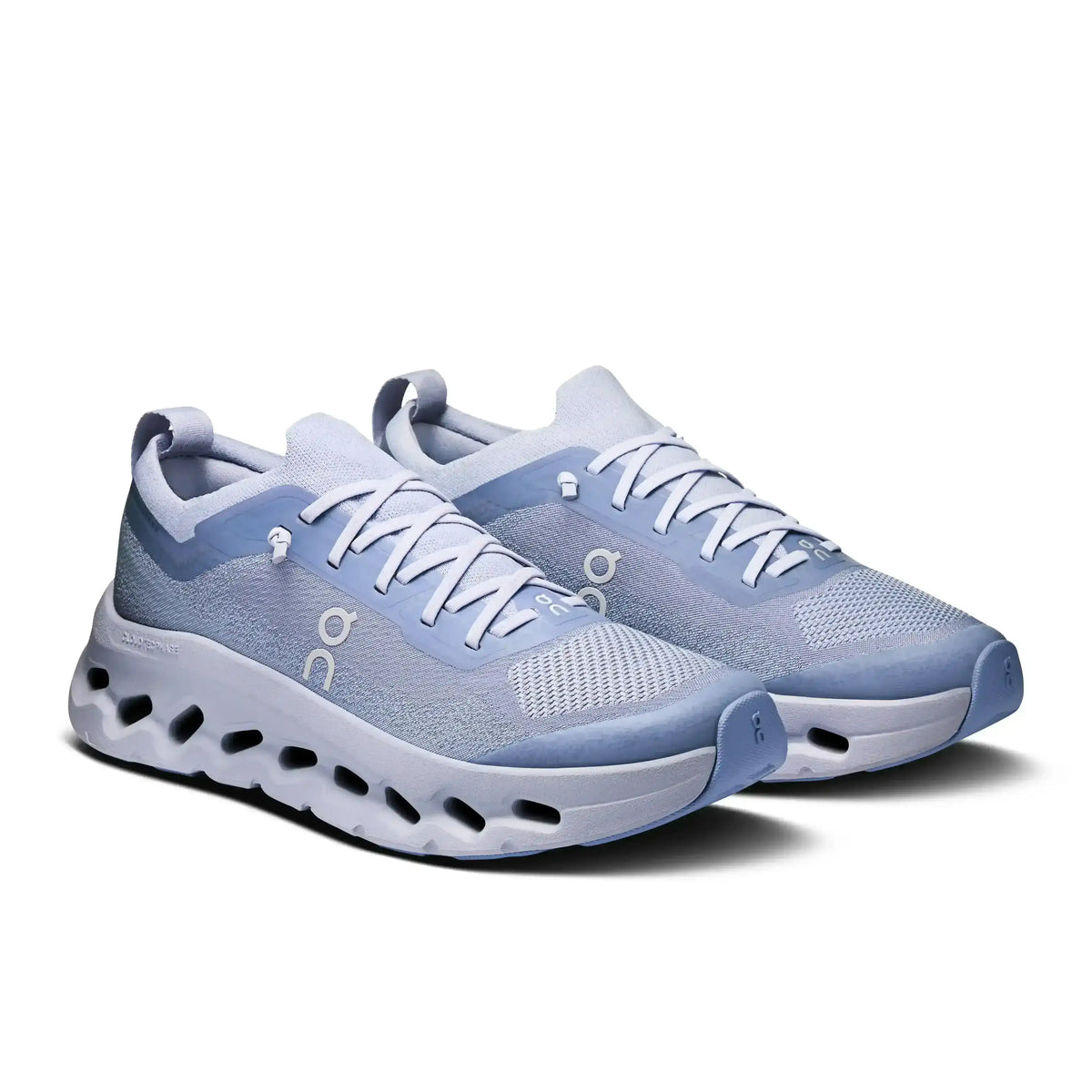 Light blue lace-up sneakers with cutout-style midsoles.